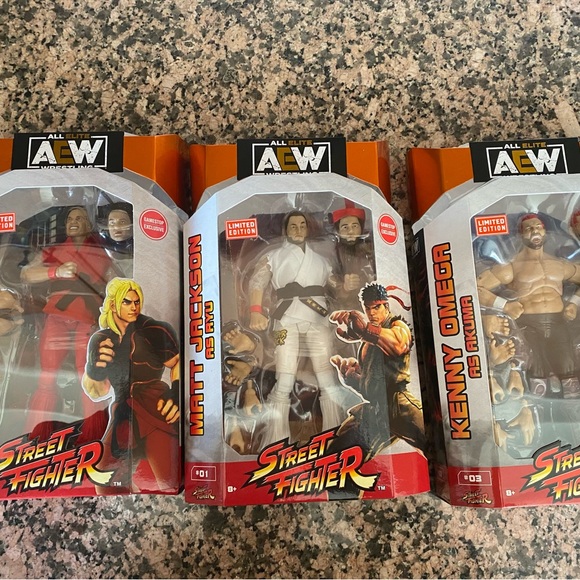 AEW The Elite - Street Fighter Set Kenny Omega Matt Nick Jackson Figures - NEW - Picture 1 of 5